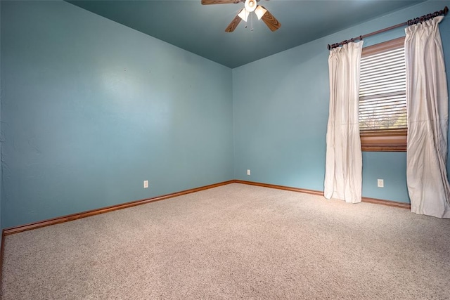 unfurnished room with carpet flooring, ceiling fan, and vaulted ceiling