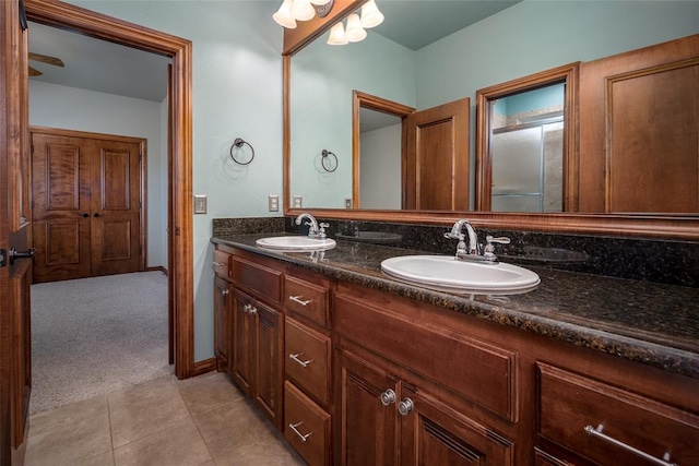 bathroom with tile patterned floors and vanity