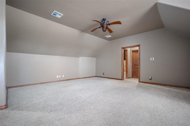 bonus room featuring ceiling fan, light carpet, and vaulted ceiling