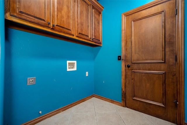 laundry room with cabinets, washer hookup, light tile patterned floors, and hookup for an electric dryer