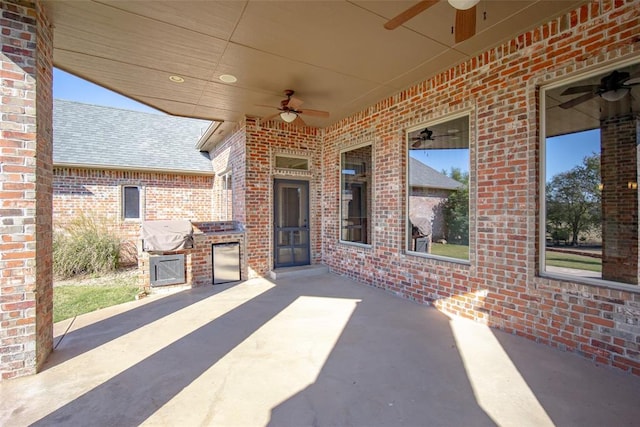 view of patio featuring an outdoor kitchen, ceiling fan, and grilling area