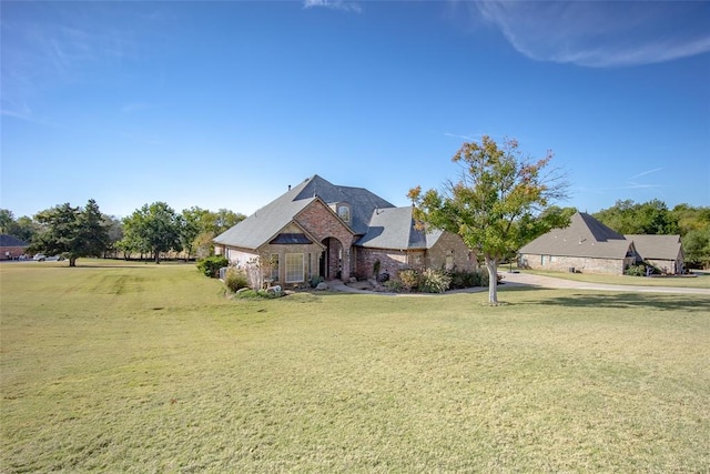 french country home with a front yard