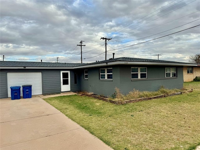 single story home with a front yard and a garage