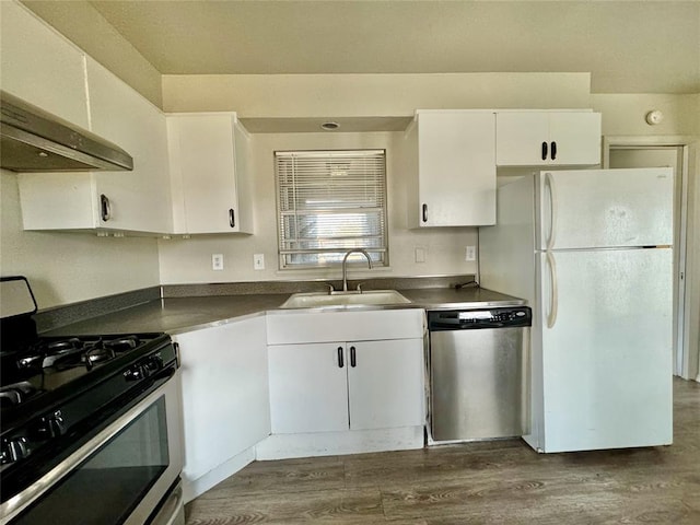 kitchen featuring sink, dark hardwood / wood-style flooring, ventilation hood, white cabinets, and appliances with stainless steel finishes