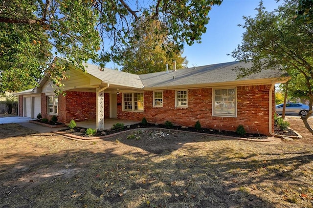 ranch-style house featuring a garage