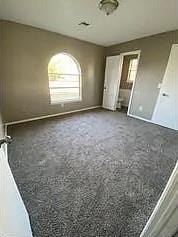 9816 NE 5th St, Midwest City, OK 73130 - unfurnished bedroom featuring multiple windows