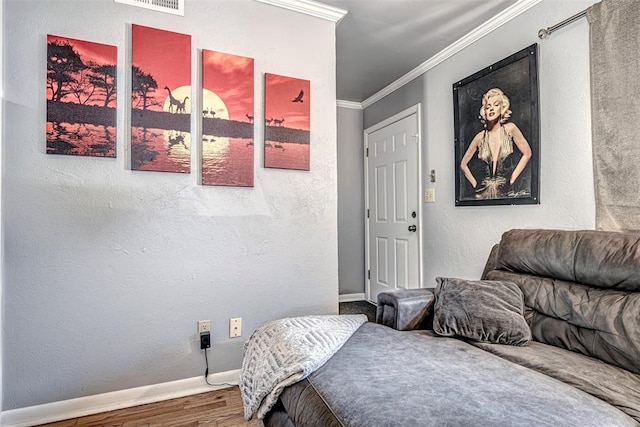 bedroom featuring crown molding and hardwood / wood-style flooring