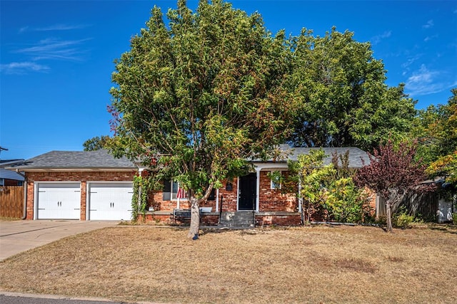 obstructed view of property featuring a garage