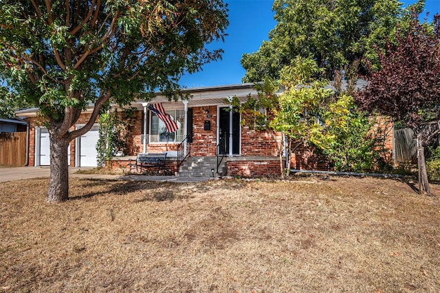 view of front of house with a porch and a garage