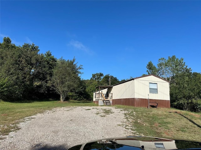 view of side of property with a wooden deck