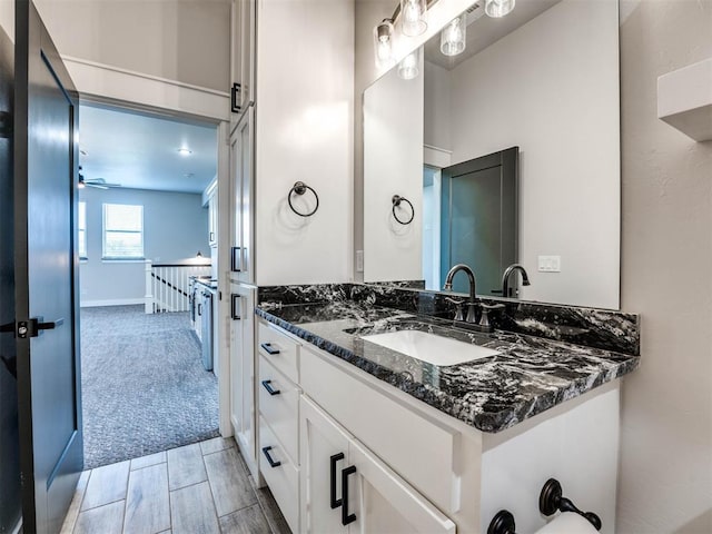 bathroom featuring vanity and ceiling fan