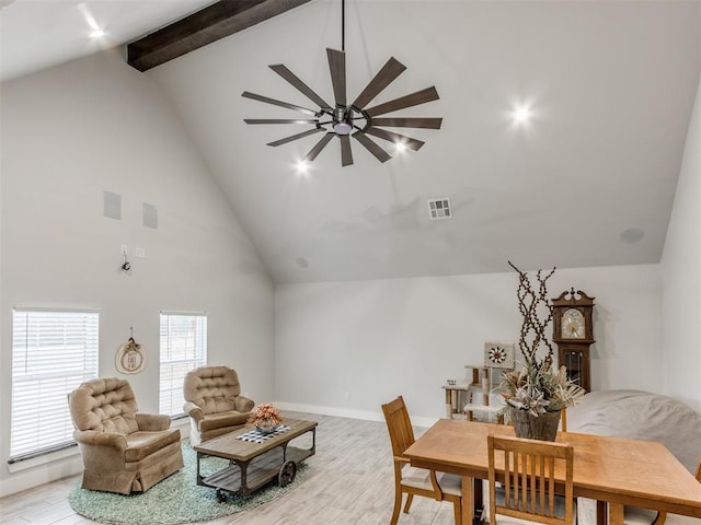 dining area with beam ceiling, ceiling fan, high vaulted ceiling, and light wood-type flooring