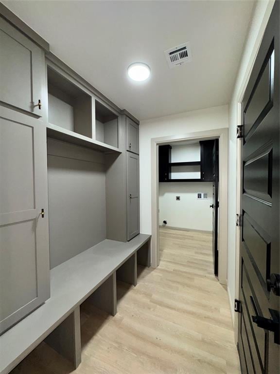 mudroom with light hardwood / wood-style floors