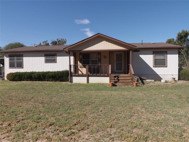 view of front of house with a porch and a front lawn