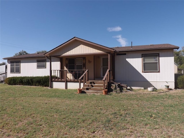 view of front of property with a front lawn and covered porch