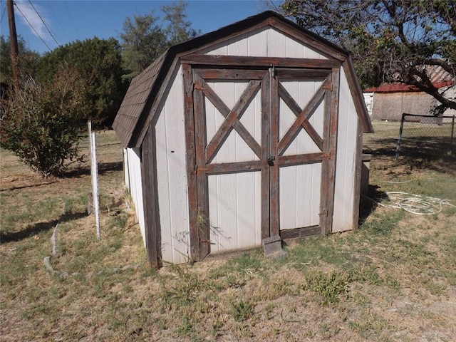 view of outbuilding with a lawn