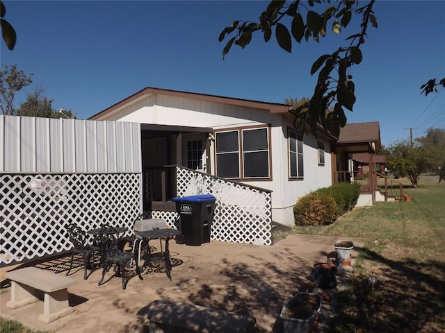 rear view of house featuring a patio