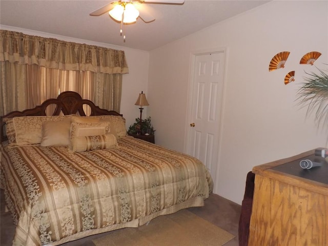 bedroom featuring ceiling fan, carpet floors, and lofted ceiling