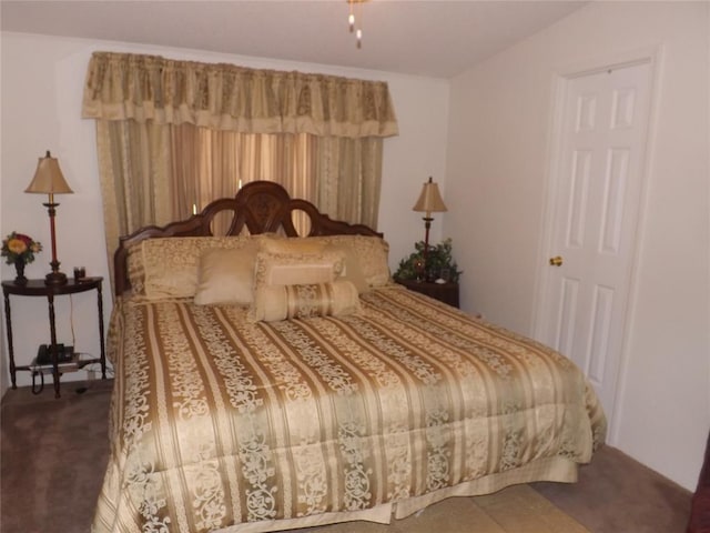 bedroom featuring dark carpet