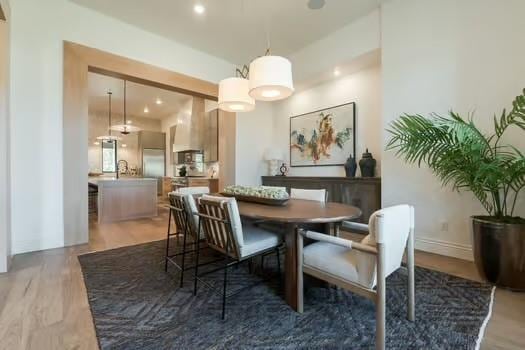 dining area with hardwood / wood-style floors