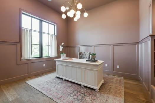 home office with a chandelier