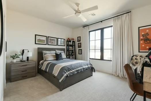 carpeted bedroom featuring ceiling fan