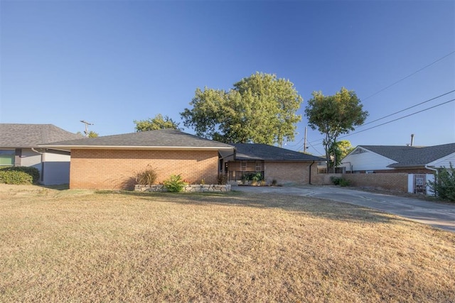 view of side of property with a lawn