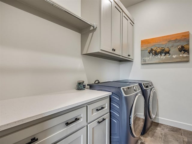 laundry room with cabinets and independent washer and dryer