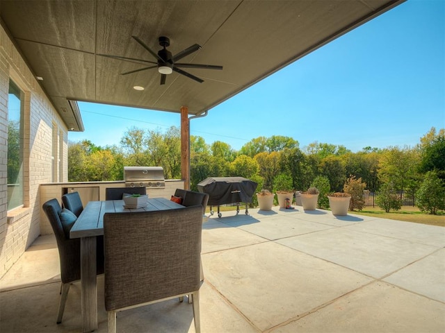 view of patio / terrace with grilling area, an outdoor kitchen, and ceiling fan