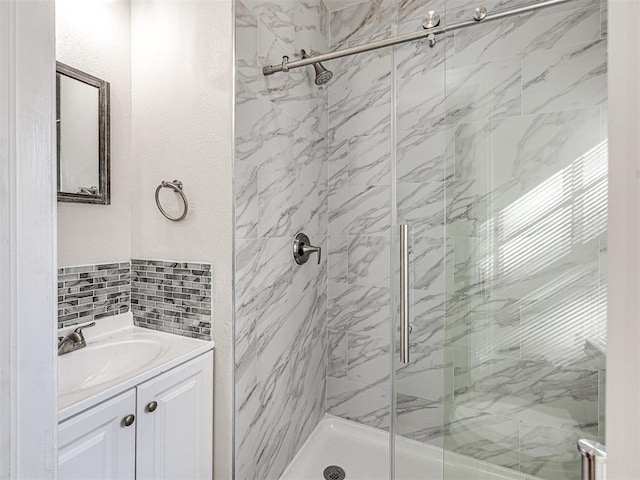 bathroom with vanity and a shower with shower door