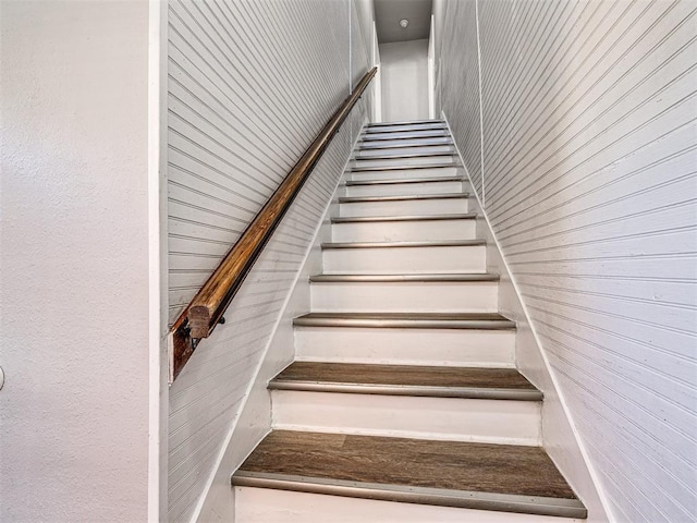 stairway with wooden walls