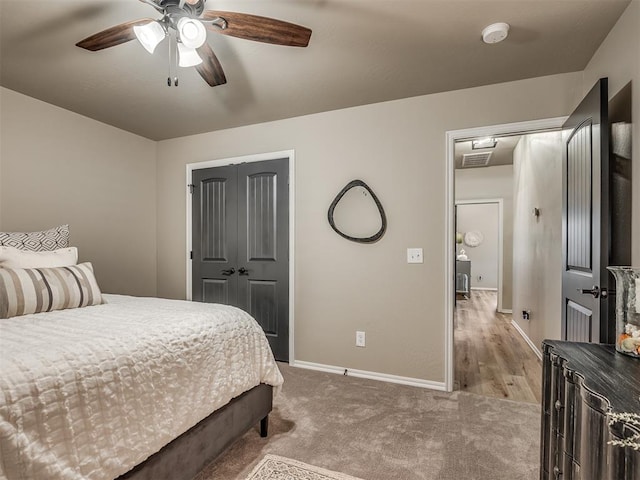 carpeted bedroom featuring ceiling fan