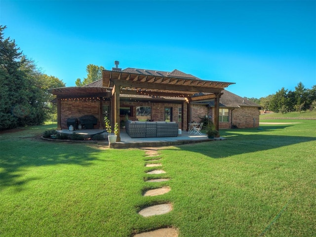 back of property with a pergola, a patio area, a lawn, and an outdoor hangout area