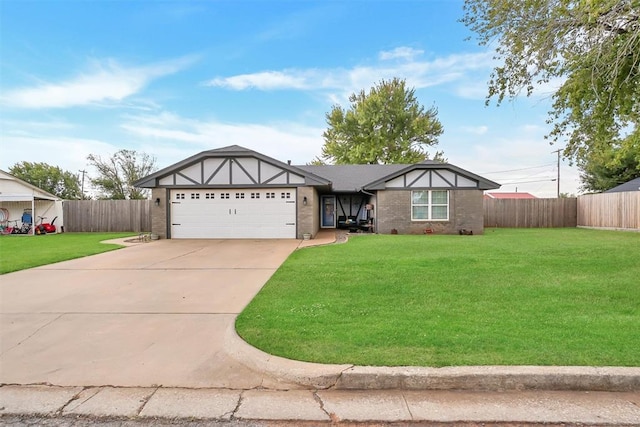 view of front of property with a garage and a front yard