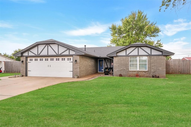 view of front of home featuring a garage and a front lawn