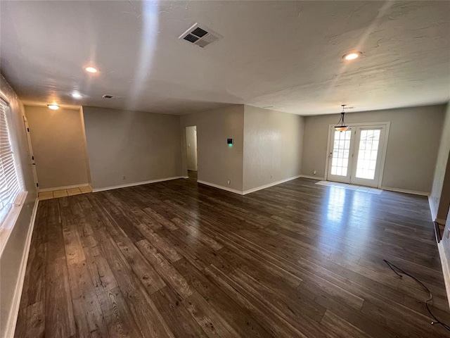 unfurnished room with french doors and dark hardwood / wood-style floors