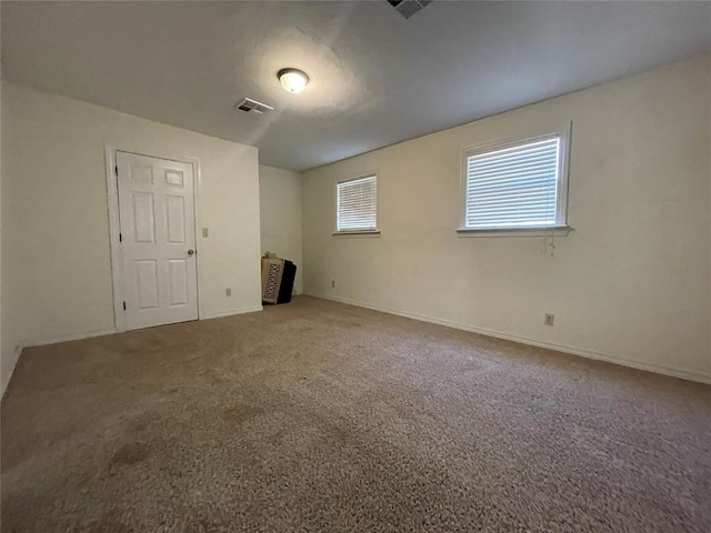 unfurnished room with carpet floors