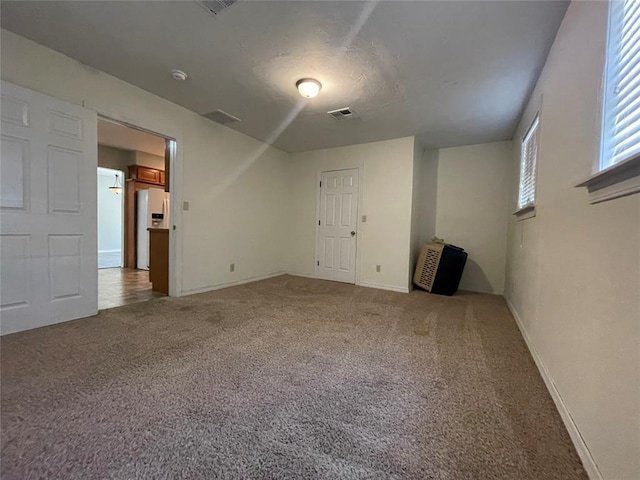 empty room with carpet flooring