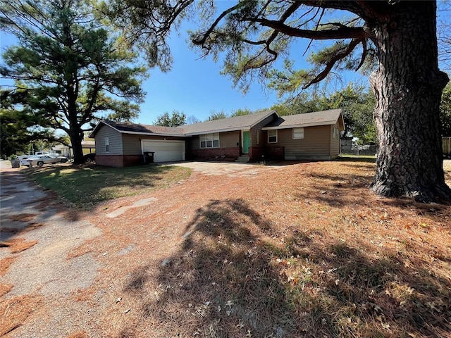 ranch-style house with a front lawn and a garage