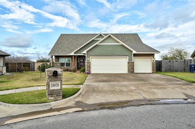 craftsman-style house featuring a front lawn and a garage