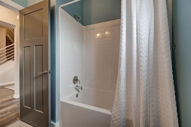 bathroom with shower / tub combo with curtain