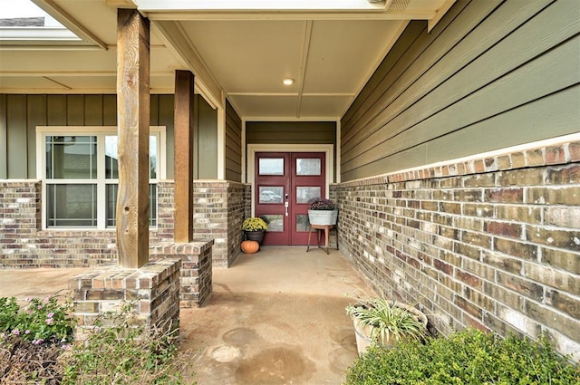 doorway to property with brick siding