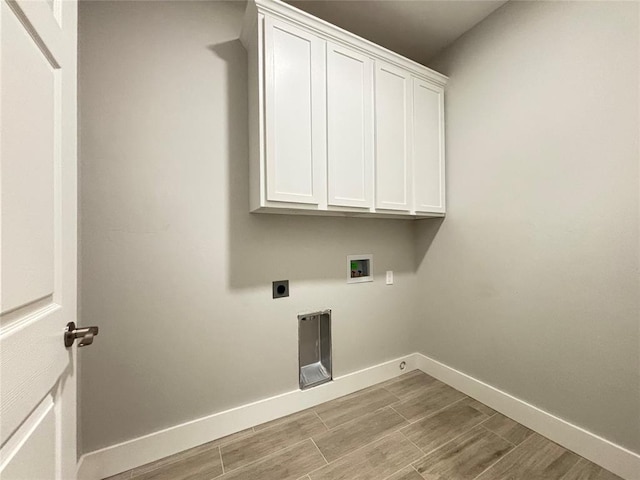 laundry room with washer hookup, cabinets, and hookup for an electric dryer