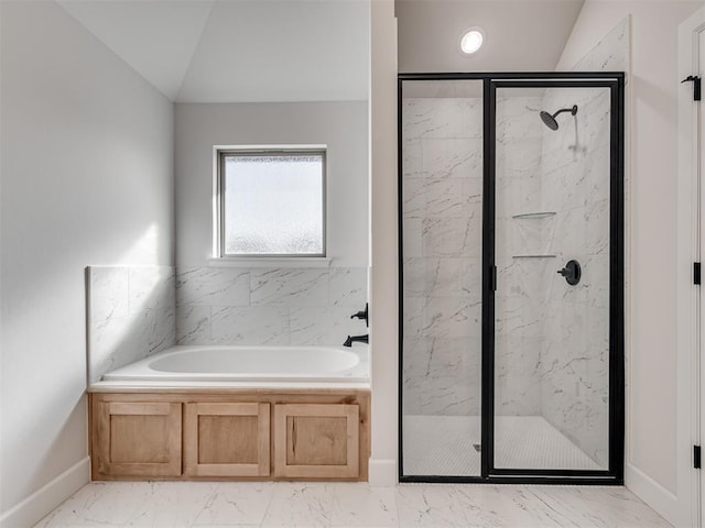 bathroom featuring lofted ceiling and shower with separate bathtub