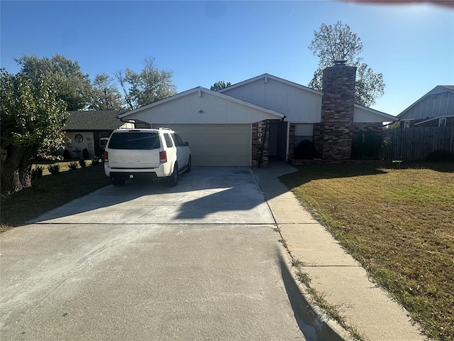 view of front of house featuring a front lawn and a garage