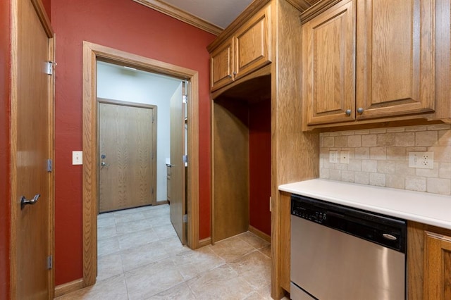 kitchen featuring backsplash, stainless steel dishwasher, and crown molding