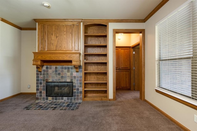 unfurnished living room with carpet flooring, crown molding, and a fireplace