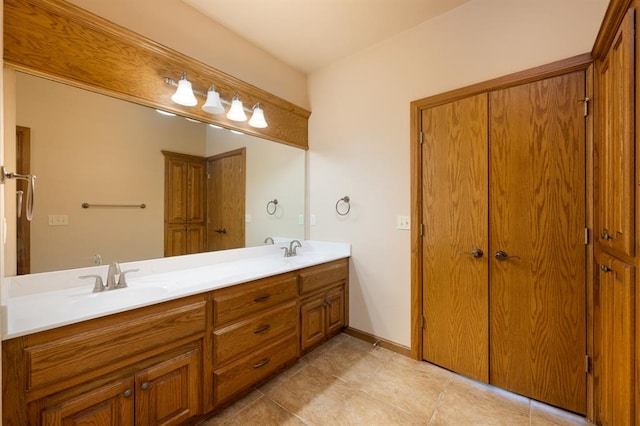 bathroom with tile patterned flooring and vanity