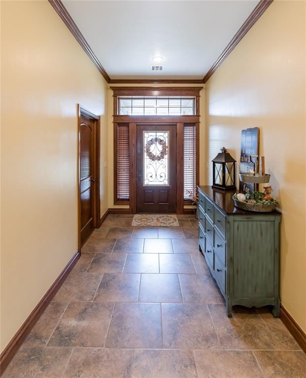 entryway featuring ornamental molding