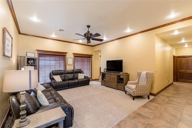 carpeted living room with ceiling fan and crown molding